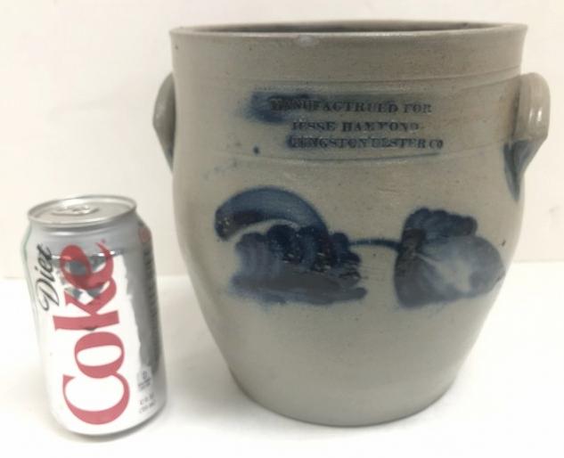 STONEWARE DECORATED CROCK - MANUFACTRUED FOR JESSE: STONEWARE DECORATED CROCK - MANUFACTRUED FOR JESSE HAMMOND KINGSTON ULSTER CO. WITH FLORAL LEAVES, HAS SURFACE HAIRLINE UNDER LEFT HANDLE, MEASURES 8.25" HIGH. I'VE SOLD MANY KINGSTON CROCKS AND AM NO