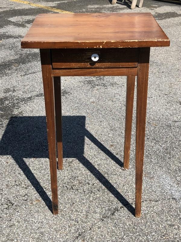 Pine country one drawer stand with tapered leg, worn finish, structurall sound. Measures 29" high x (1 of 1)