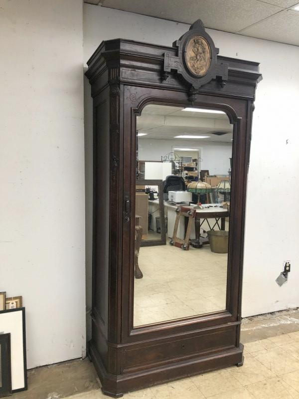 Victorian 1 door armoire with mirrored door & brass cherub placque on top crest, has shelves inside (1 of 9)