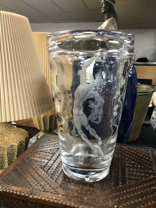 Orrefors 12.5" high crystal vase with etched nude men on both sides, partial paper label, signed on: Orrefors 12.5" high crystal vase with etched nude men on both sides, partial paper label, signed on base ( Orrefors L. 1348 C9 KR ?). In excellent condition, from Hudson Valley fine homeâ€¦.