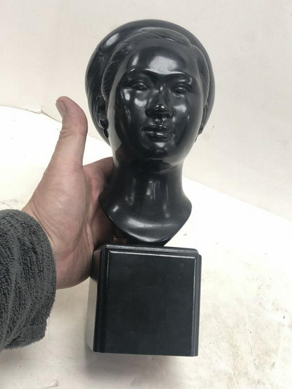 Bronze bust of woman on wood base, dark patina (almost black ), marked on back illegibly, measures: Bronze bust of woman on wood base, dark patina (almost black ), marked on back illegibly, measures 11" high. From Hudson, N.Y. estate of noted Art Collector Albert Burnette Roberts (1932-2021). His 40