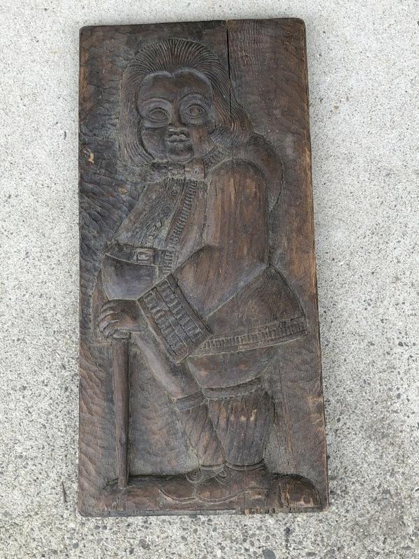 Early carved wood panel with man holding a stick, made of hardwood, has writing on back as pictured (1 of 7)