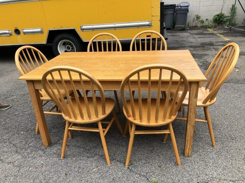 Contemporary oak rectangular kitchen table with 6 maple spindle back chairs, was used in kitchen of (1 of 2)