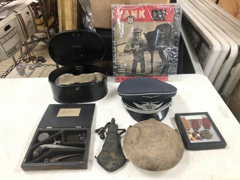 Estate Military etc. lot incl. German Officer's cap, canteen ( no cap, unsure of origin ), (3): Estate Military etc. lot incl. German Officer's cap, canteen ( no cap, unsure of origin ), (3) British War Cross Medals, (1) issue of YANK Magazine, dented powder container, pair epaulettes, & antique