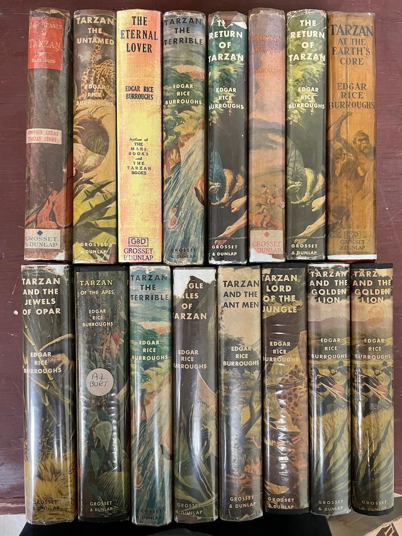 21 Edgar Rice Burroughs Grosset & Dunlap dust jacket. This lot has no book catalogs on the reverse.: 21 Edgar Rice Burroughs Grosset & Dunlap dust jacket. This lot has no book catalogs on the reverse. At least one (The Eternal Lover) has a reproduction dust jacket. The rest have wear and fading comme