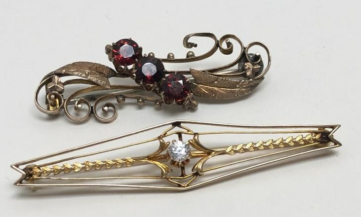 (2) 14K ladies bar pins ( 1 with garnets & other with faux diamond ), weight is 5.4 dwt. ( one pin (1 of 3)