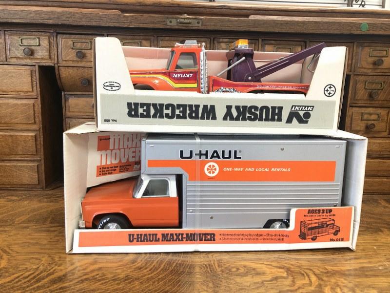 (2) Nylint 1980's trucks in boxes, includes Husky Wrecker & Uhaul maxi-mover, just as we found them (1 of 4)