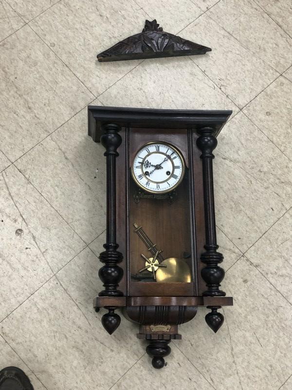 As found Paul Hallman wall clock, loose wood top, one side glass panel laying inside, enamel face (1 of 5)