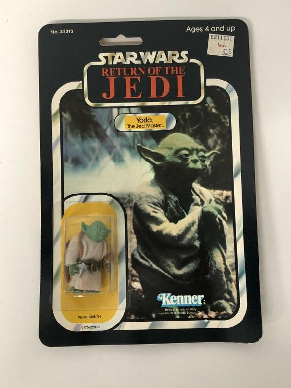 Star Wars action figure Yoda in unopened package, 1983, carboard has a curve on bottom right. No. (1 of 2)