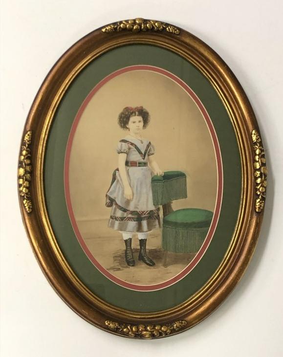Hand Painted photograph young girl, with Photographers chair, frame measures 18" x 14", sealed on: Hand Painted photograph young girl, with Photographers chair, frame measures 18" x 14", sealed on verso. From the estate collection of Richard G. Miller's 19th & 20th century hand painted, coloured & 