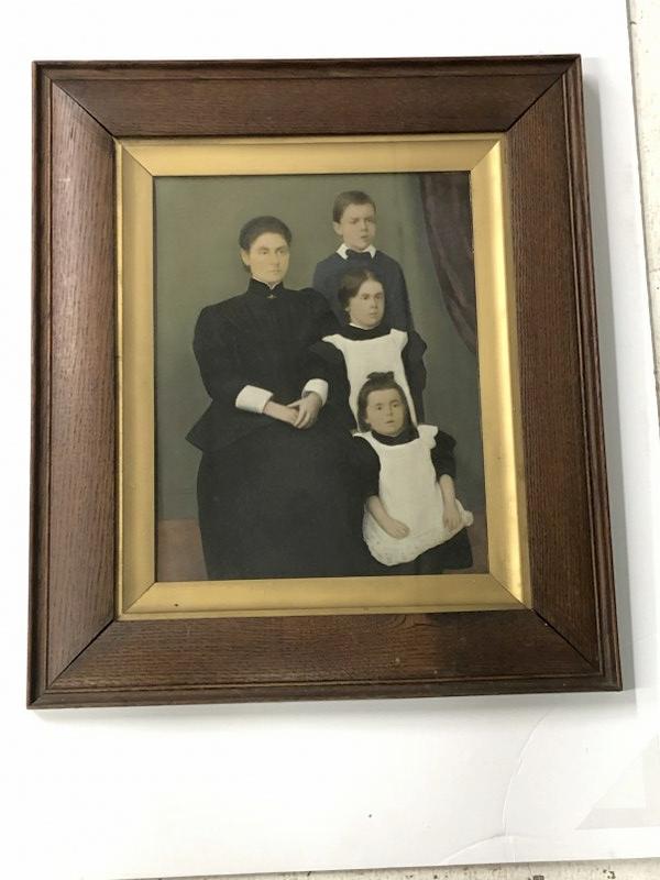 Hand Painted photograph of family, possibly a tintype, frame measures 22" x 19", cardboard backing, (1 of 2)
