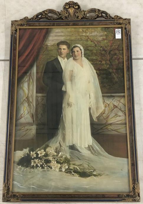Large Hand Painted wedding photograph. Frame measures 36" x 22.25."  From the estate collection of (1 of 2)