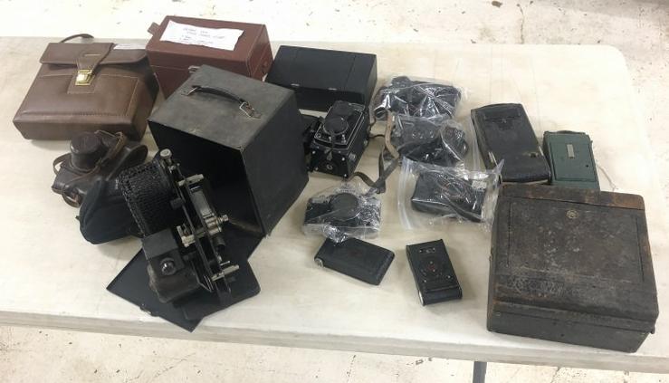 Estate lot older & newer cameras, incl. old projector, just as we found them in the estate, some: Estate lot older & newer cameras, incl. old projector, just as we found them in the estate, some with notes on them.