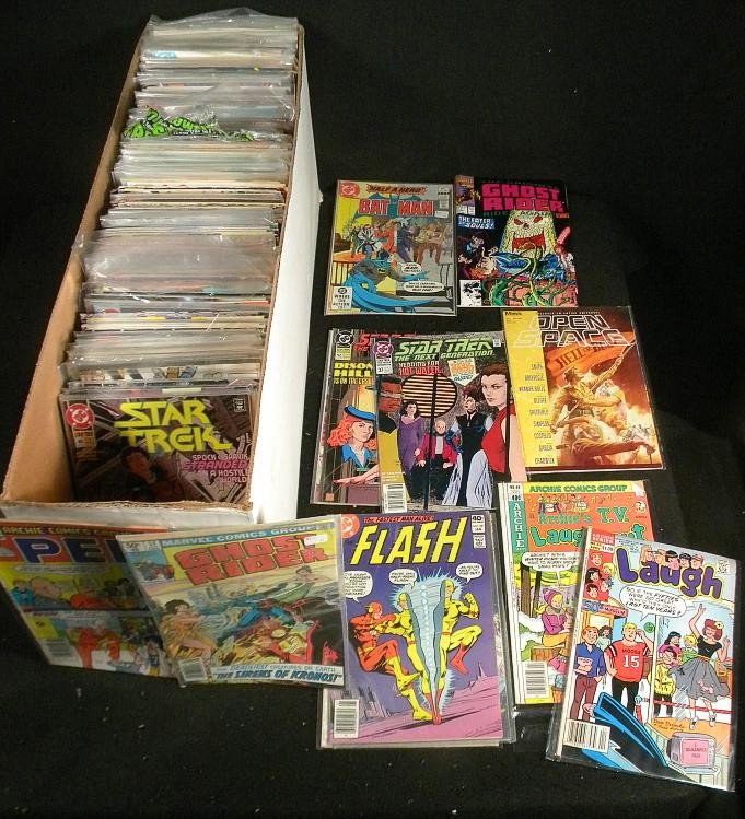 Box Lot of 300-400 70s-90s comics: Box Lot of 250-300 70s-90s comics. Comics include, but not limited to Batman, Disney Comics, Elfquest, Ghost Rider, and Spectacular Spiderman, and Daffy Qaddafi