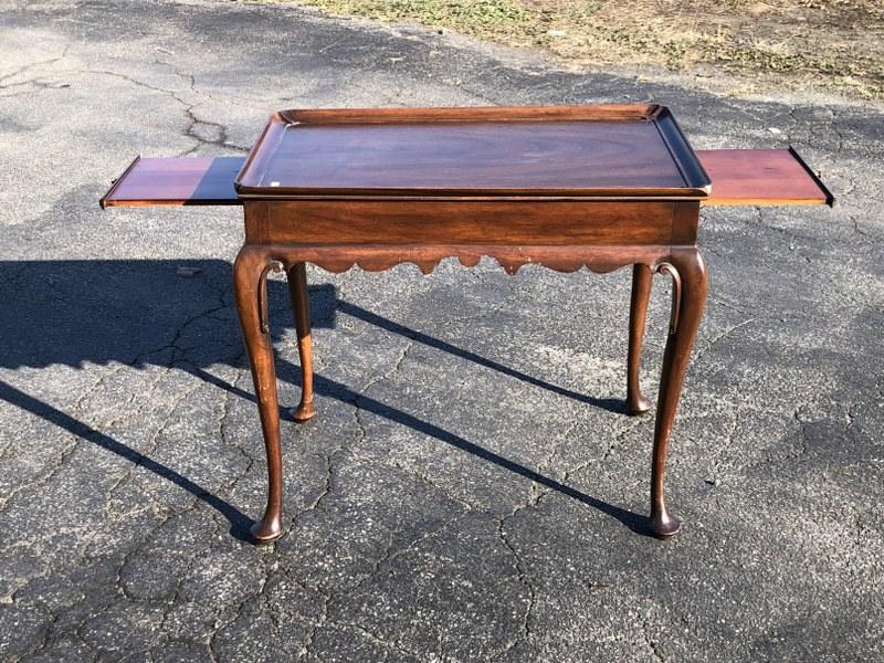 Virginia Galleries mahogany formal side table, with pullouts on each end, padded feet & carved: Virginia Galleries mahogany formal side table, with pullouts on each end, padded feet & carved apron, from fine Catskill, N.Y. home, nice and clean. Measures 29.5" wide x 18" deep x 26.75" high.