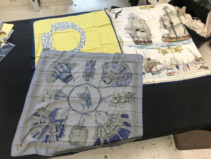 (2) HERMES & (1) CARTIER scarfs, from local estate, non smoking home. The HERMES silk scarf with: (2) HERMES & (1) CARTIER scarfs, from local estate, non smoking home. The HERMES silk scarf with ships has some small light stains, the other (2) I see no spots or damage. The HERMES scarf with CUIRS