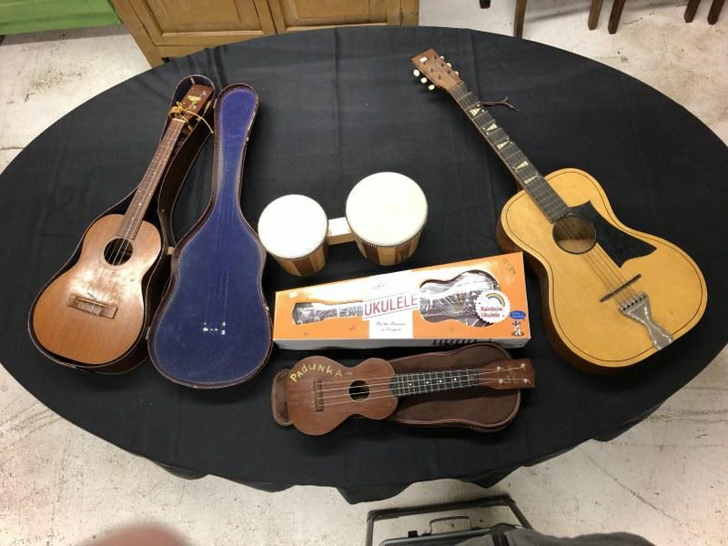 Misc. estate musical instrument lot to include ( bongo drums, Ukelele in box, older Ukelele with (1 of 6)