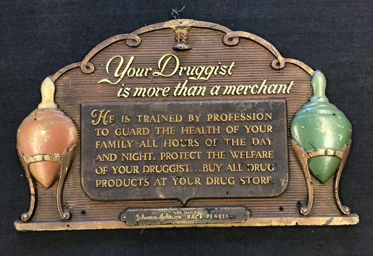 Wonderful old Johnson & Johnson advertising Druggist sign, made of a compostion material, in very (1 of 3)