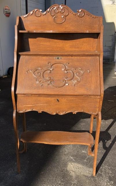 Circa 1900 oak carved drop front desk, with a drawer, old finish, (split on drawer), structurally (1 of 1)