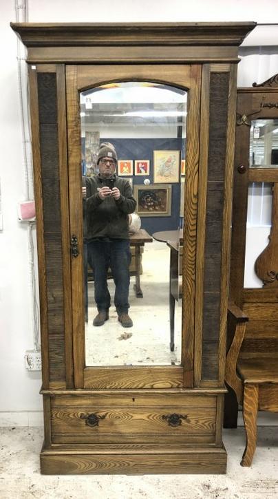 Circa 1900 oak one door armoire with beveled mirror, (4) adjustable shelves on inside, and drawer on (1 of 3)