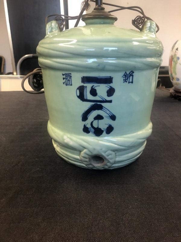 Old Japan sake barrel converted to table lamp, measures 10" high to top of barrel & 19" to top of: Old Japan sake barrel converted to table lamp, measures 10" high to top of barrel & 19" to top of harp. From Catskill, N.Y. estate of a fine gentleman.