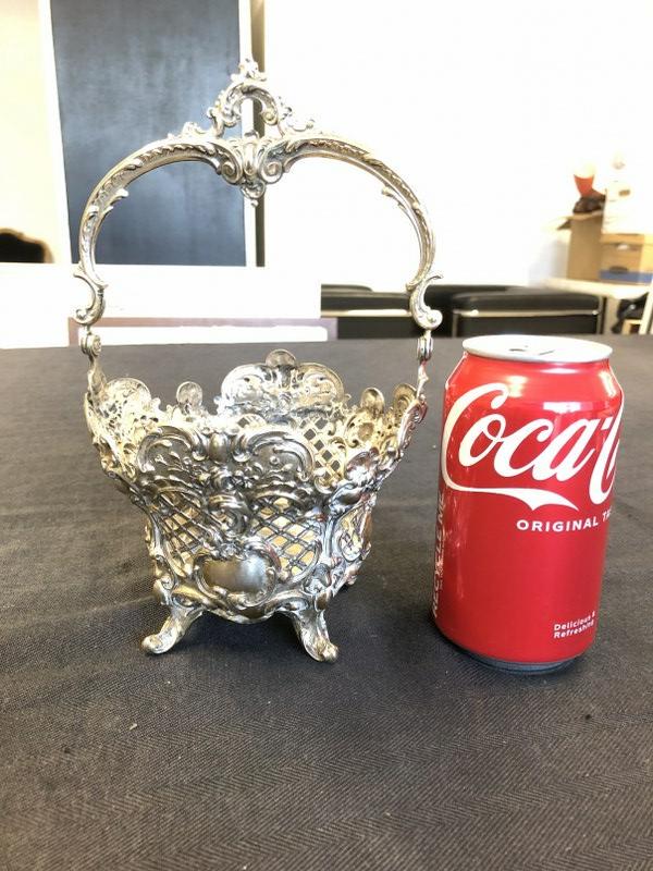 Wonderful sterling basket with intricate detail, no insert, measures approx. 4" high and 9" high to: Wonderful sterling basket with intricate detail, no insert, measures approx. 4" high and 9" high to top of handle, weighs 5.94 troy ounces.