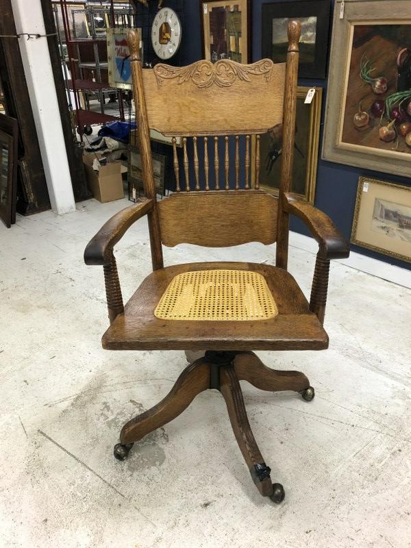 Circa 1900 oak swivel desk armchair with good caned seat and pressed back, on foot has clamp on,: Circa 1900 oak swivel desk armchair with good caned seat and pressed back, on foot has clamp on, from Long Island, N.Y. estate.