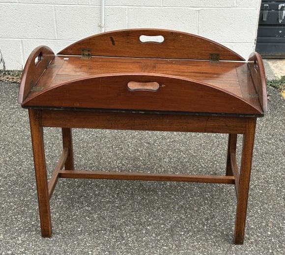 Mahogany Butler's coffee table with lift top tray, has some age, stretcher base, measures approx.: Mahogany Butler's coffee table with lift top tray, has some age, stretcher base, measures approx. 28.5" x 18.5" x 24" high. Structurally sound, from Vassar College Professor's estate.