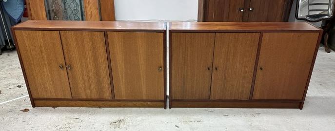 (2) Danish Modern teak narrow console cabinets, each with (3) doors and shelves inside, have: (2) Danish Modern teak narrow console cabinets, each with (3) doors and shelves inside, have different knobs, from fine Poughkeepsie, N.Y. home, structurally sound, they measure 49" long x 29" high x 