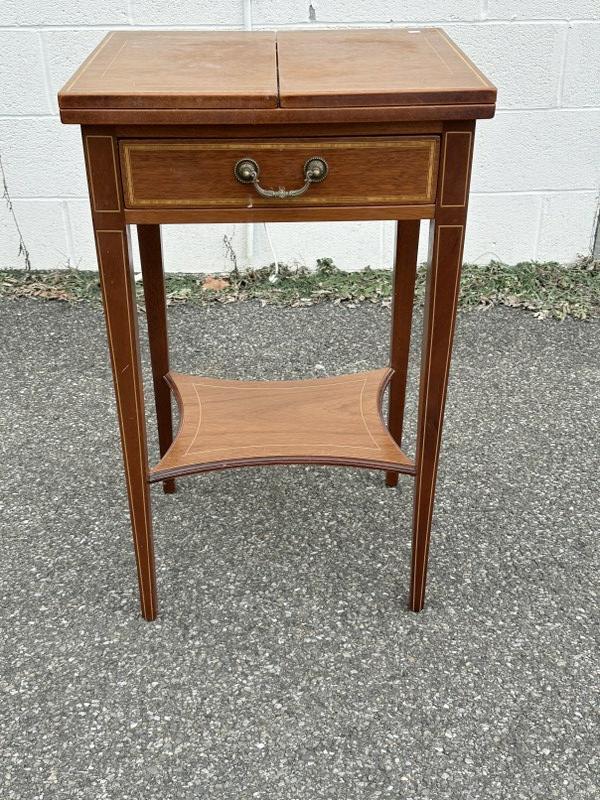 Satinwood inlaid flip top stand, with one drawer, has (2) slides that pullout from sides to hold: Satinwood inlaid flip top stand, with one drawer, has (2) slides that pullout from sides to hold tops. Label in drawer made by VAL BRYAN in Dublin, maker of reproduction furniture. From estate of Vass
