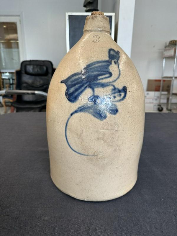 Stoneware 3 gallon jug with bird on flower, measures approx. 16.5" high, has non professional handle: Stoneware 3 gallon jug with bird on flower, measures approx. 16.5" high, has non professional handle repair as pictured. From Hudson Valley estate.