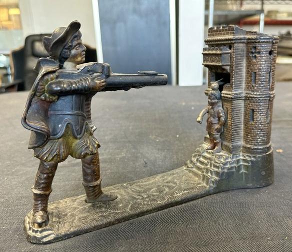 1896 J & E Stevens William Tell Cast Iron Mechanical Bank with some original paint intact, mechanism: 1896 J & E Stevens William Tell Cast Iron Mechanical Bank with some original paint intact, mechanism in working order, nice estate found condition, I see no damage or repairs. Meassures 10.75" long.