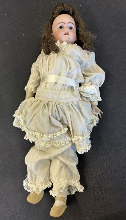Large HANDWERCK German bisque head doll, found in estate, original body, glass eyes, ( no damage to: Large HANDWERCK German bisque head doll, found in estate, original body, glass eyes, ( no damage to head ), marked on back as pictured, open mouth, teeth intact. Measures approx. 29" top to bottom.