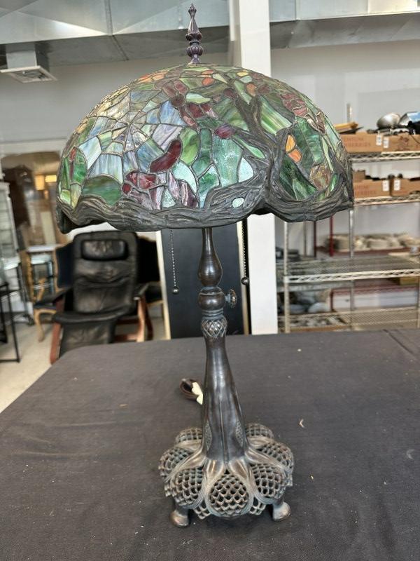 Vintage reproduced Tiffany style table lamp, with bronze base, from local estate,my guess is lamp is: Vintage reproduced Tiffany style table lamp, with bronze base, from local estate,my guess is lamp is 20 plus years or so, Made in China, leaded shape in nice condition, lamp measures approx. 27" high.