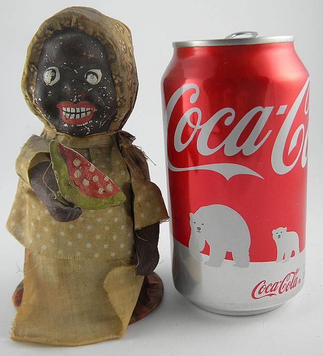 19th Century Composition Black Woman Eating Waterm: 19th Century Composition Black Woman Eating Watermelon, from Hudson Valley estate. I thought it was a candy container, but does not open, original clothing, face has some flakes. Hands feel like they