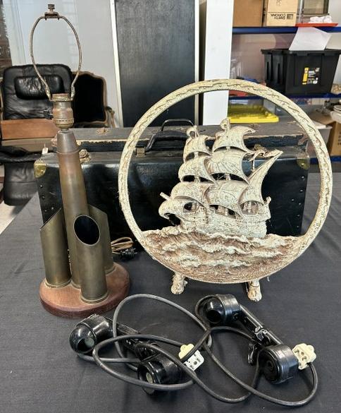 (3) pc. Misc. estate lot to include WW II shell art table lamp, cast iron ship radio speaker frame & (1 of 4)