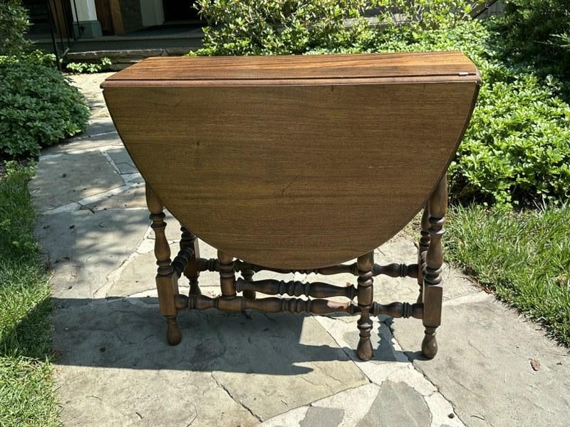 Walnut gate leg table in nice estate condition, closed it measures 33" W X 13" D X 30" H (1 of 4)