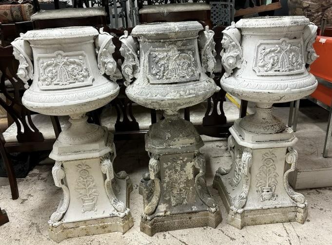 (3) older decorative cast aluminum urns with figural heads on sides, and flowers in pots on all (1 of 8)
