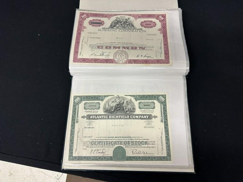 Approx. 90 vintage stock & bond certificates in album, some duplicates. (1 of 9)