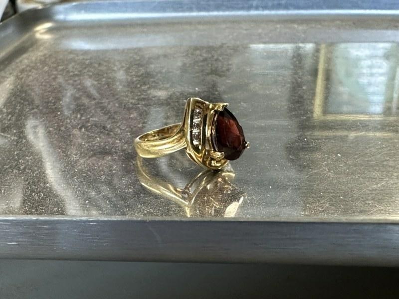 10K ladies garnet ring with (3) diamond chips. From local estate, size is 4.25, weighs 1.8 dwt. (1 of 4)