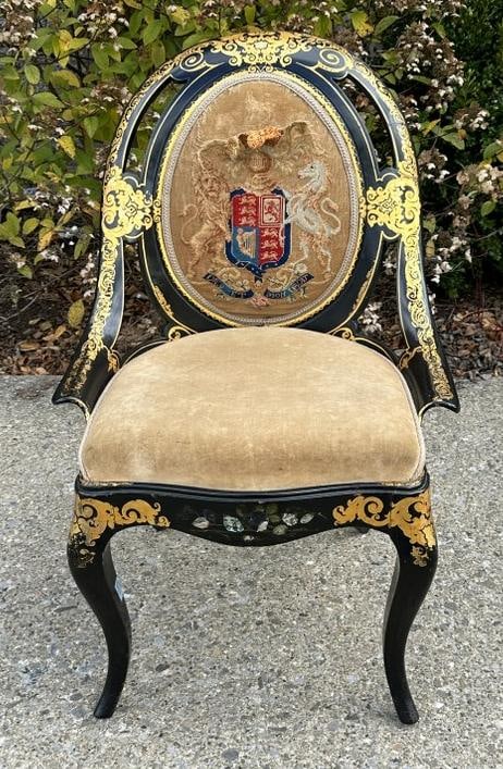 19th c papier mache armchair with needlepoint crest on back ( Needlepoint is torn, as pictured ),: 19th c papier mache armchair with needlepoint crest on back ( Needlepoint is torn, as pictured ), wonderful form, with spectacular gilding. Measures 35" high x 23" across. From fine estate of family w