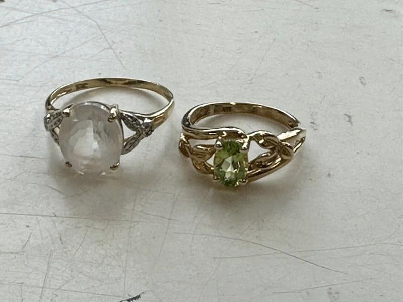 (2) 10K ladies rings to include yellow gold with synthetic stone & peridot yellow gold, both weigh (1 of 3)