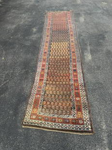 Handmade wool oriental runner, from fine estate's indoor climate controlled storage facility, in: Handmade wool oriental runner, from fine estate's indoor climate controlled storage facility, in storage over 20 years, has a few small holes, and wear mostly on one end, good looking pattern.