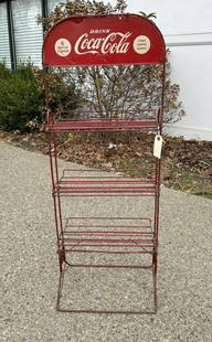 Old Coca Cola metal store rack for cartons, found in Hudson Valley, structurally sound, retains most: Old Coca Cola metal store rack for cartons, found in Hudson Valley, structurally sound, retains most all of the paint. It measures 46 1/2" high x 18" wide.