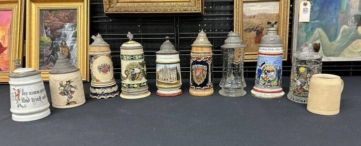 (10) old steins from local Hudson Valley estate, just as we found them. Good mix for dealer to sort: (10) old steins from local Hudson Valley estate, just as we found them. Good mix for dealer to sort out, the small Mettlach has no lid. Tallest measures 10" high to show scale.