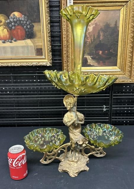 Circa 1900 epergne with figural woman holding an umbrella, made of white metal or spelter. From: Circa 1900 epergne with figural woman holding an umbrella, made of white metal or spelter. From Hudson Valley estate ( the top part of metal that holds the top in is missing a piece off it ), all the 
