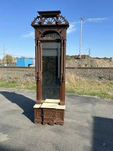 Fancy Victorian pier mirror with marble on base, with (3) drawers and (2) doors at base. Has older: Fancy Victorian pier mirror with marble on base, with (3) drawers and (2) doors at base. Has older brownish paint or finish, measures 101" high x 30 1/2" wide x 14" deep at base. From Highland, N.Y. e