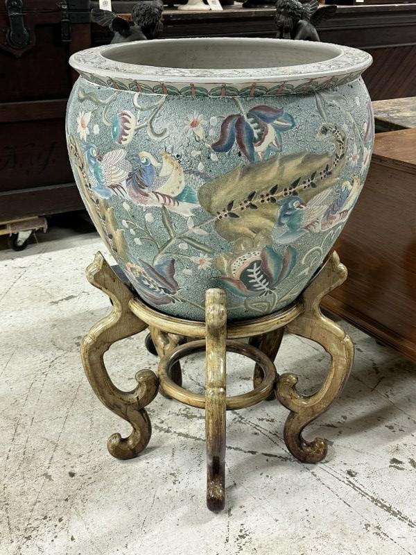 Large decorative ceramic Asian jardinaire on sun bleached base, signed on bottom as pictured. From: Large decorative ceramic Asian jardinaire on sun bleached base, signed on bottom as pictured. From Hudson Valley estate. In good condition, no damage, measures 18" high x 21" across the top not includ