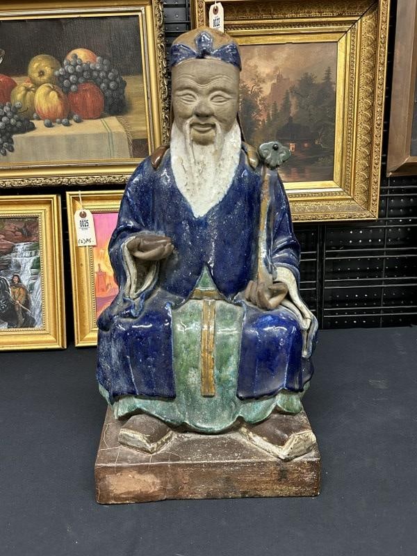 24 1/2" high Chinese ceramic gentleman seated with objects in both hands. (1 of 7)