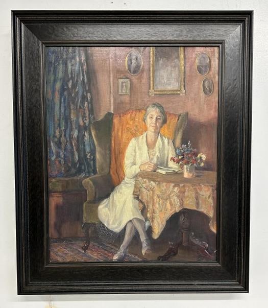 Edward Reynolds Kingsbury (1855 - 1940) o/b woman seated in chair reading book, with paintings on: Edward Reynolds Kingsbury (1855 - 1940) o/b woman seated in chair reading book, with paintings on the wall and flowers on the table. Signed lower left, nice overall condition, in nice contemporary oak